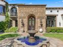 Ornate entryway with fountain and arched doorway at 7714 N Calle Caballeros --, Paradise Valley, AZ 85253