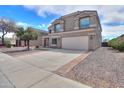 Two-story house with a two-car garage at 1749 E Wildflower Ln, Casa Grande, AZ 85122