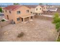 Backyard view of house with gravel and block wall at 18774 N Ibis Way, Maricopa, AZ 85138