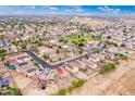 Aerial view of residential neighborhood with houses and streets at 18774 N Ibis Way, Maricopa, AZ 85138