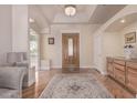 Bright entryway with hardwood floors and built-in storage at 8052 E Mcdowell Rd, Mesa, AZ 85207