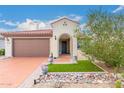 Beautiful desert landscaping highlights this single-story home at 27467 W Osprey Dr, Buckeye, AZ 85396