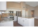 Modern kitchen with granite countertops and stainless steel appliances at 13348 W Cambridge Ave, Goodyear, AZ 85395