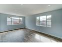 Bright living room with wood-look floors and large windows at 3823 W Augusta Ave, Phoenix, AZ 85051