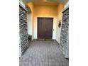 Elegant entryway with double doors and stone accents at 4450 S Rio Dr, Chandler, AZ 85249