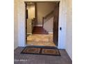 Inviting entryway with tile flooring and staircase leading to upper level at 4450 S Rio Dr, Chandler, AZ 85249