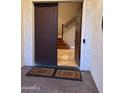 Open double doors to an entryway with a staircase at 4450 S Rio Dr, Chandler, AZ 85249