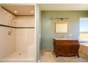 Bathroom with a walk-in shower, vanity with granite top, and soaking tub at 29408 N 244Th Dr, Wittmann, AZ 85361