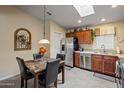 Kitchen with stainless steel appliances and wood cabinets at 3104 E Broadway Rd # 51, Mesa, AZ 85204