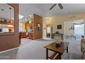 Open living room with vaulted ceiling, carpet, and kitchen view at 3104 E Broadway Rd # 51, Mesa, AZ 85204