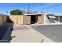 Side view of mobile home with covered storage area at 2434 E Main St # 3, Mesa, AZ 85213