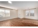 Bright and spacious living room with hardwood floors and neutral colors at 8143 E Obispo Ave, Mesa, AZ 85212