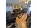 Living room with comfortable seating and wood flooring at 1541 W Yurok Ave, Apache Junction, AZ 85119