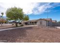 Single-story home with landscaped front yard, walkway, and gravel at 1741 E Palm Parke Blvd, Casa Grande, AZ 85122