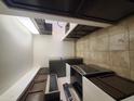 Modern kitchen with stainless steel appliances and dark wood cabinets at 3314 N 68Th St # 204, Scottsdale, AZ 85251