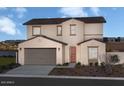 Two-story house with beige walls and terracotta roof at 9243 E Sector Dr, Mesa, AZ 85212