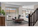 Spacious living room with sectional sofa and wood coffee table at 9237 E Sector Dr, Mesa, AZ 85212