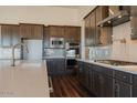 Modern kitchen with stainless steel appliances and a quartz countertop at 3823 W Lodge Dr, Laveen, AZ 85339