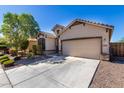 House exterior with driveway and landscaping at 1952 N 212Th Ln, Buckeye, AZ 85396