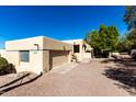 Tan stucco home with a single car garage at 6159 S Avenida Del Sol --, Gold Canyon, AZ 85118