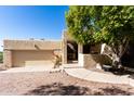 Tan stucco home with a covered entryway and garage at 6159 S Avenida Del Sol --, Gold Canyon, AZ 85118