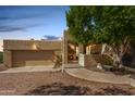 Tan stucco home with a covered entryway and garage at 6159 S Avenida Del Sol --, Gold Canyon, AZ 85118