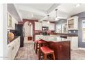 Modern kitchen with an island and ample cabinet space at 7752 W Mary Jane Ln, Peoria, AZ 85382