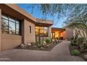 Contemporary home with a landscaped walkway and desert plants at 9719 E Madera Dr, Scottsdale, AZ 85262
