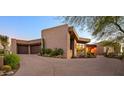 Modern home with brick exterior and a curved driveway at 9719 E Madera Dr, Scottsdale, AZ 85262