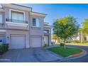 Townhome with two-car garage and manicured lawn at 8180 E Shea Blvd # 1012, Scottsdale, AZ 85260