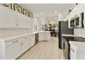Modern white kitchen with stainless steel appliances at 23817 S Harmony Way, Sun Lakes, AZ 85248