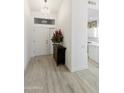 Bright entryway with wood-look tile floors at 23817 S Harmony Way, Sun Lakes, AZ 85248
