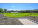 Community park with grassy area and playground at 12568 W Orangewood Ave, Glendale, AZ 85307
