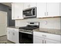 Modern kitchen with stainless steel appliances at 12568 W Orangewood Ave, Glendale, AZ 85307