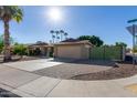 Ranch style home with large driveway and gate at 10650 N 49Th Ave, Glendale, AZ 85304