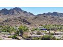 Community nestled in the mountains with various house styles at 3007 E Calaveros Dr, Phoenix, AZ 85028