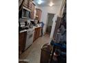 Bright kitchen with ample cabinetry and tile flooring at 7300 N 51St Ave # F 99, Glendale, AZ 85301