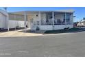 Mobile home exterior with carport and landscaping at 7750 E Broadway Rd # 761, Mesa, AZ 85208