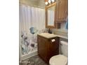 Clean bathroom with wood vanity and shower/tub at 7750 E Broadway Rd # 761, Mesa, AZ 85208