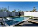 Inviting backyard pool with lounge chairs and modern landscaping at 1004 E Tempe Dr, Tempe, AZ 85281