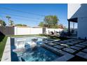Backyard with a large pool, spa, and plenty of lounge chairs at 1004 E Tempe Dr, Tempe, AZ 85281