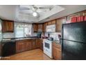 Kitchen with wood cabinets and granite countertops at 2416 W Caribbean Ln # 1, Phoenix, AZ 85023