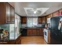 Kitchen with wood cabinets and granite countertops at 2416 W Caribbean Ln # 1, Phoenix, AZ 85023