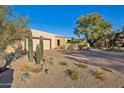 Two-story home with landscaped yard and desert plants at 3044 Ironwood Rd, Carefree, AZ 85377