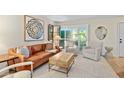 Living room with leather sofa, armchairs, and a wooden coffee table at 4620 N 68Th St # 136, Scottsdale, AZ 85251