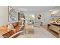 Bright living room featuring a leather couch and modern decor at 4620 N 68Th St # 136, Scottsdale, AZ 85251