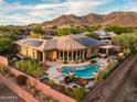 Luxury home with solar panels, pool, and mountain views at 42121 N Anthem Creek Dr, Anthem, AZ 85086