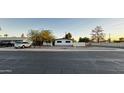 Single story house with a landscaped front yard and a white fence at 2207 E Aspen Ave, Mesa, AZ 85204