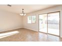 Bright dining room with sliding glass door to backyard and tile flooring at 28475 N Moonstone Way, San Tan Valley, AZ 85143