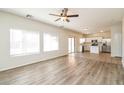 Open concept kitchen with stainless steel appliances and island at 409 E Saddle Way, San Tan Valley, AZ 85143